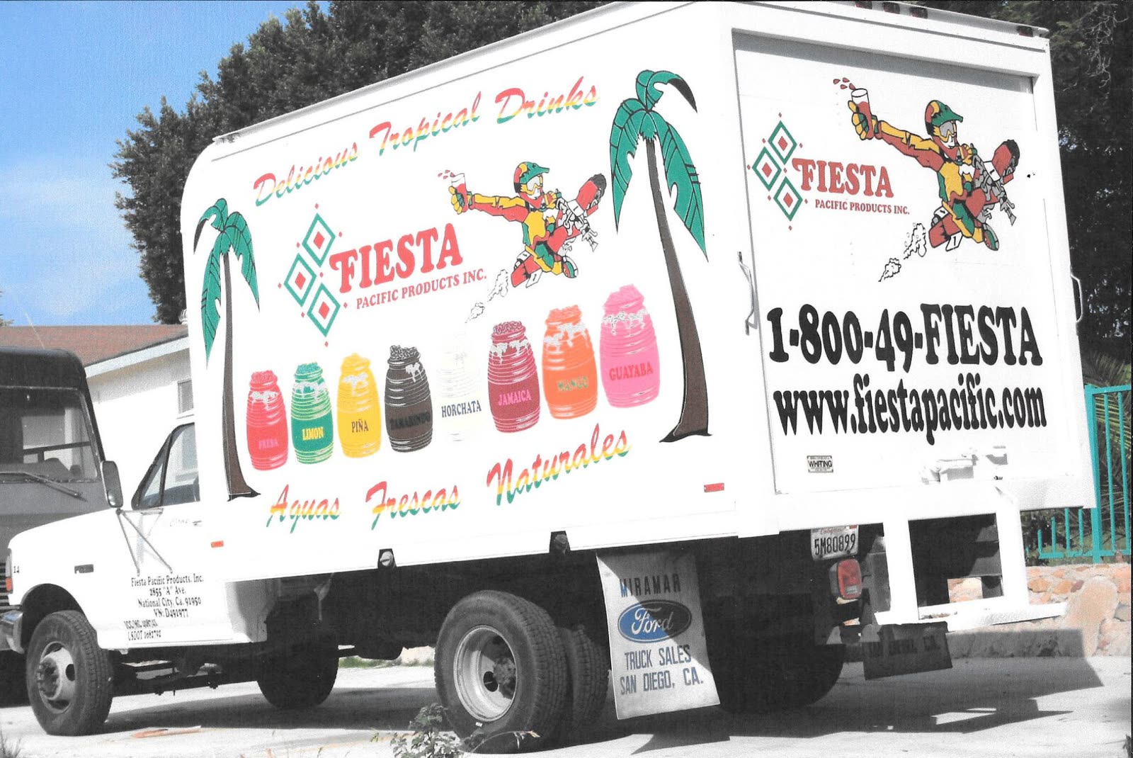 Fiesta Pacific Products box truck wrapped with palm trees, aguas frescas barrels and the Fiesta logo