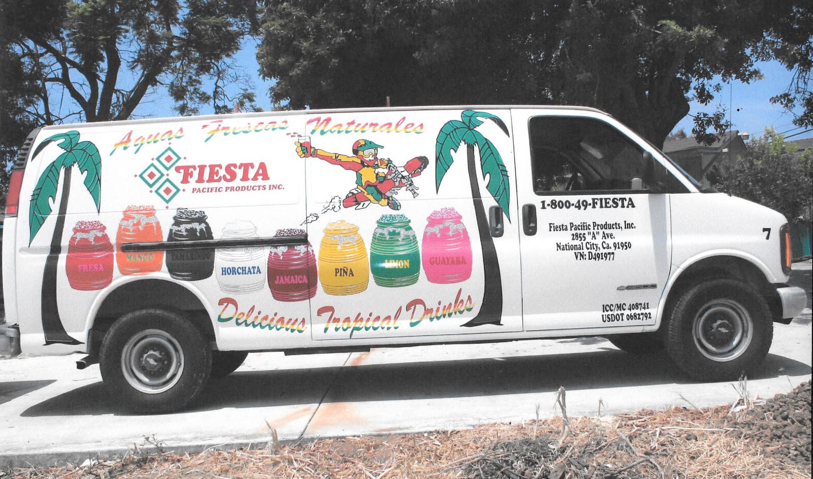 White cargo van with Fiesta Pacific Products wrap showing eight drink flavors and palm trees