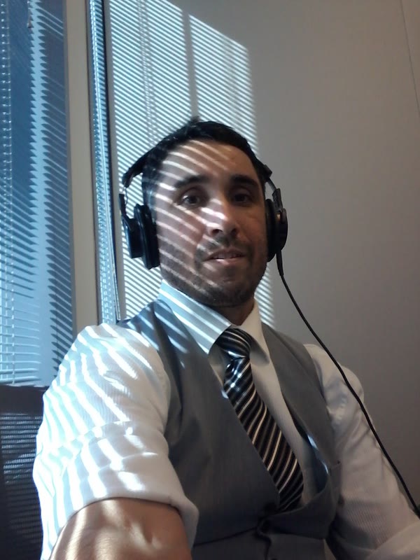 Daniel Bermudez wearing studio headphones at his desk